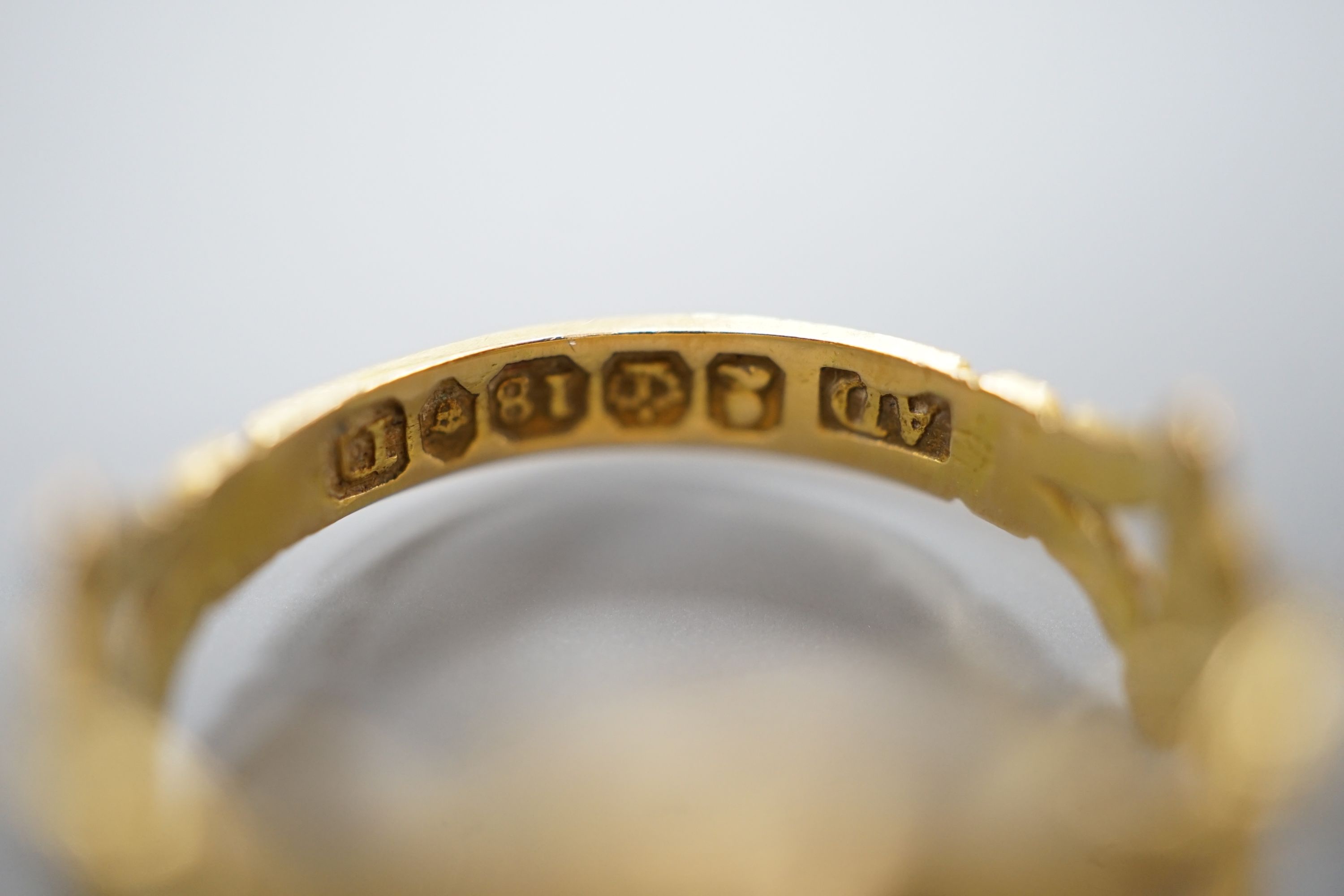 A George IV 18ct gold, black enamel and plaited hair set mourning ring, with engraved monogram, size M, gross weight 3.3 grams (a.f.).
